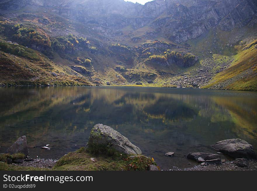 Mountains in the reflection of the lake Mzy. Caucasus. Abkhazia. Mountains in the reflection of the lake Mzy. Caucasus. Abkhazia