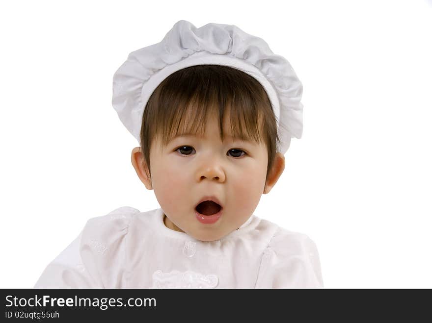 Cute chef baby with brown hair and open mouth