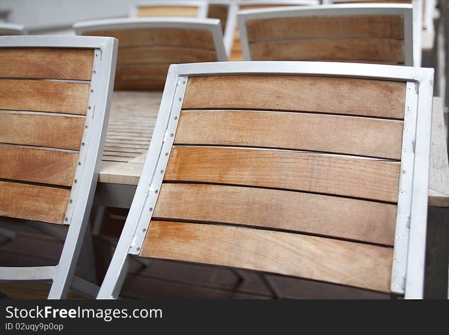 Gastronmoy chairs leaning against table