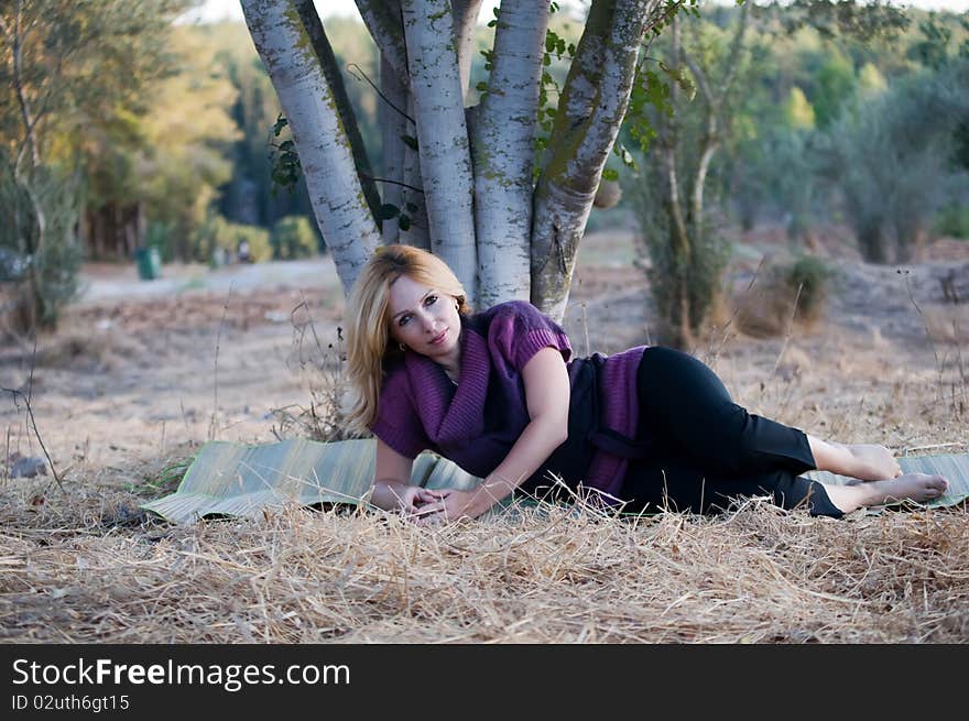 Beautiful woman with fair hair lying and enjoy on the meadow  . Beautiful woman with fair hair lying and enjoy on the meadow  .