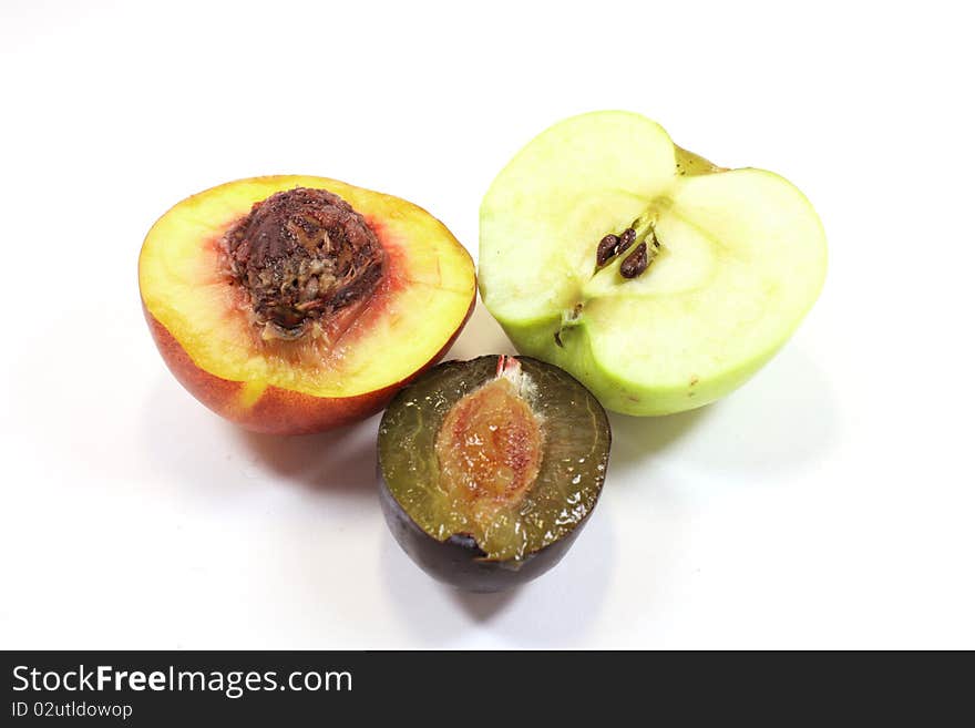 Peachy, apple and plums on a white background. Peachy, apple and plums on a white background