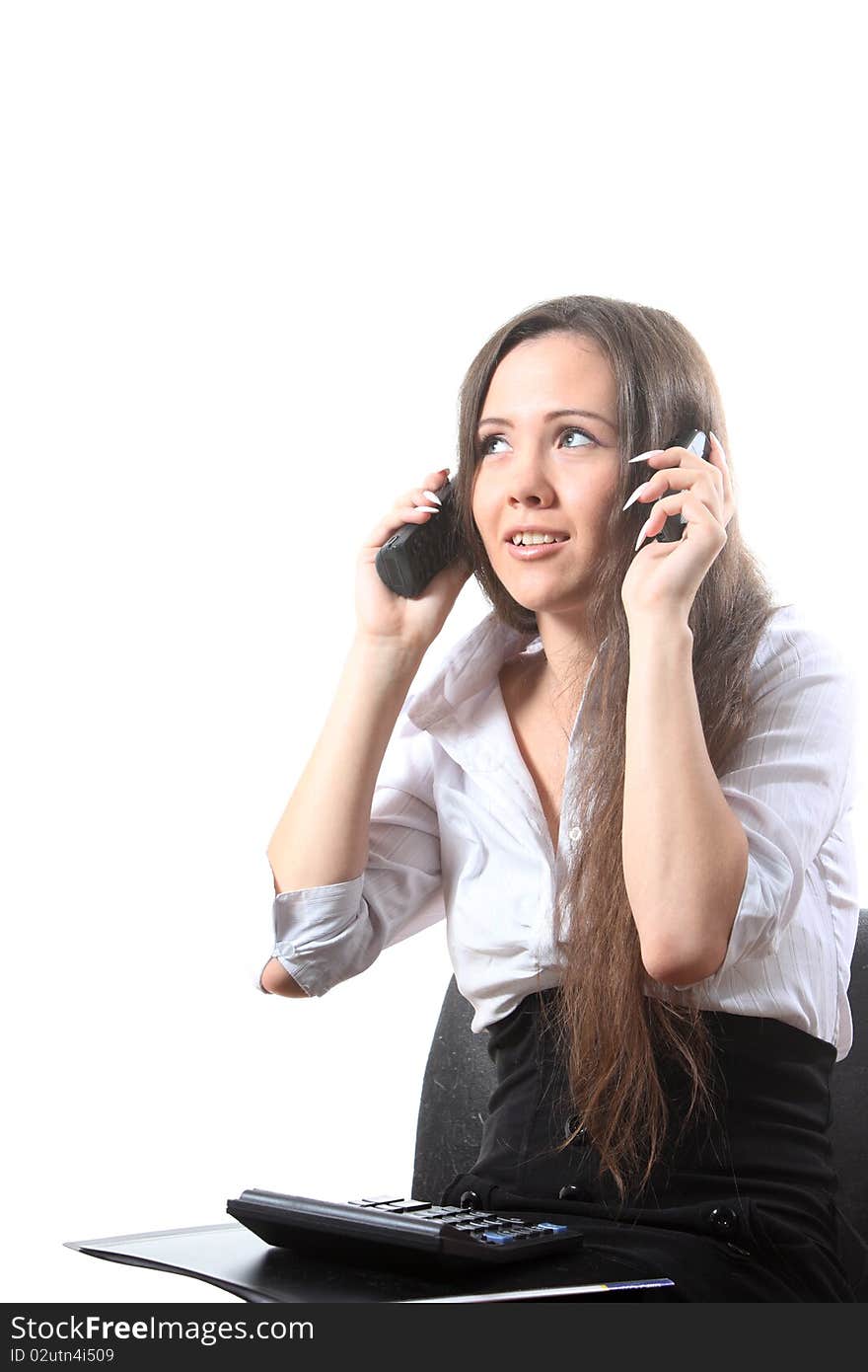 Surprised businesswoman speak by two phones