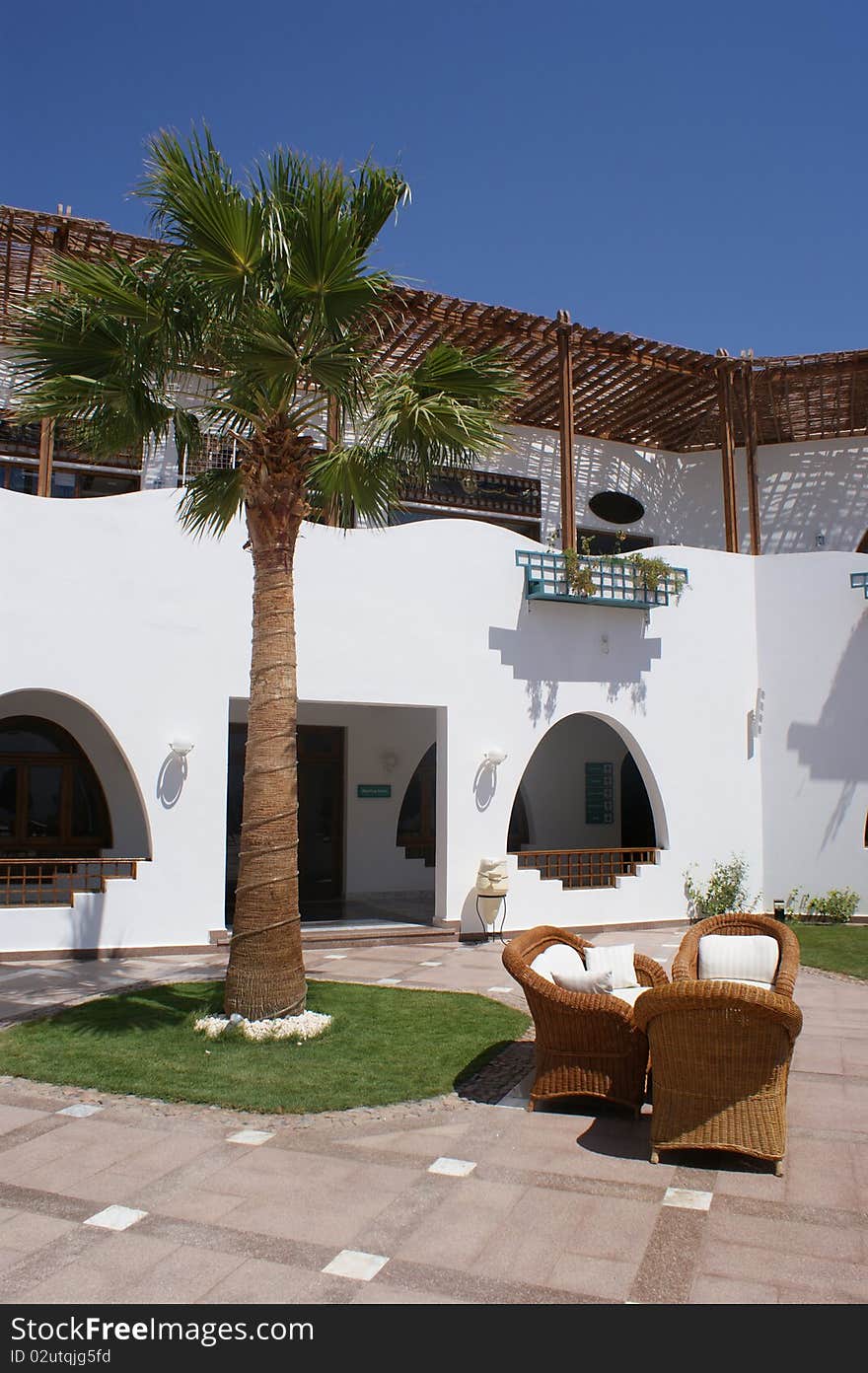 Table and armchair in hotel open air