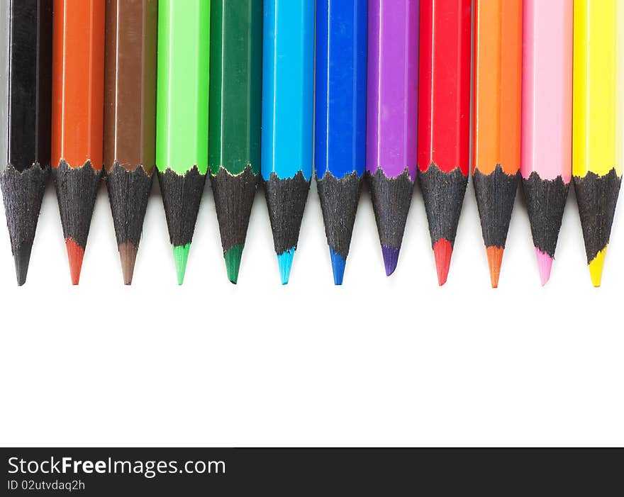 Colored pencils isolated over white background