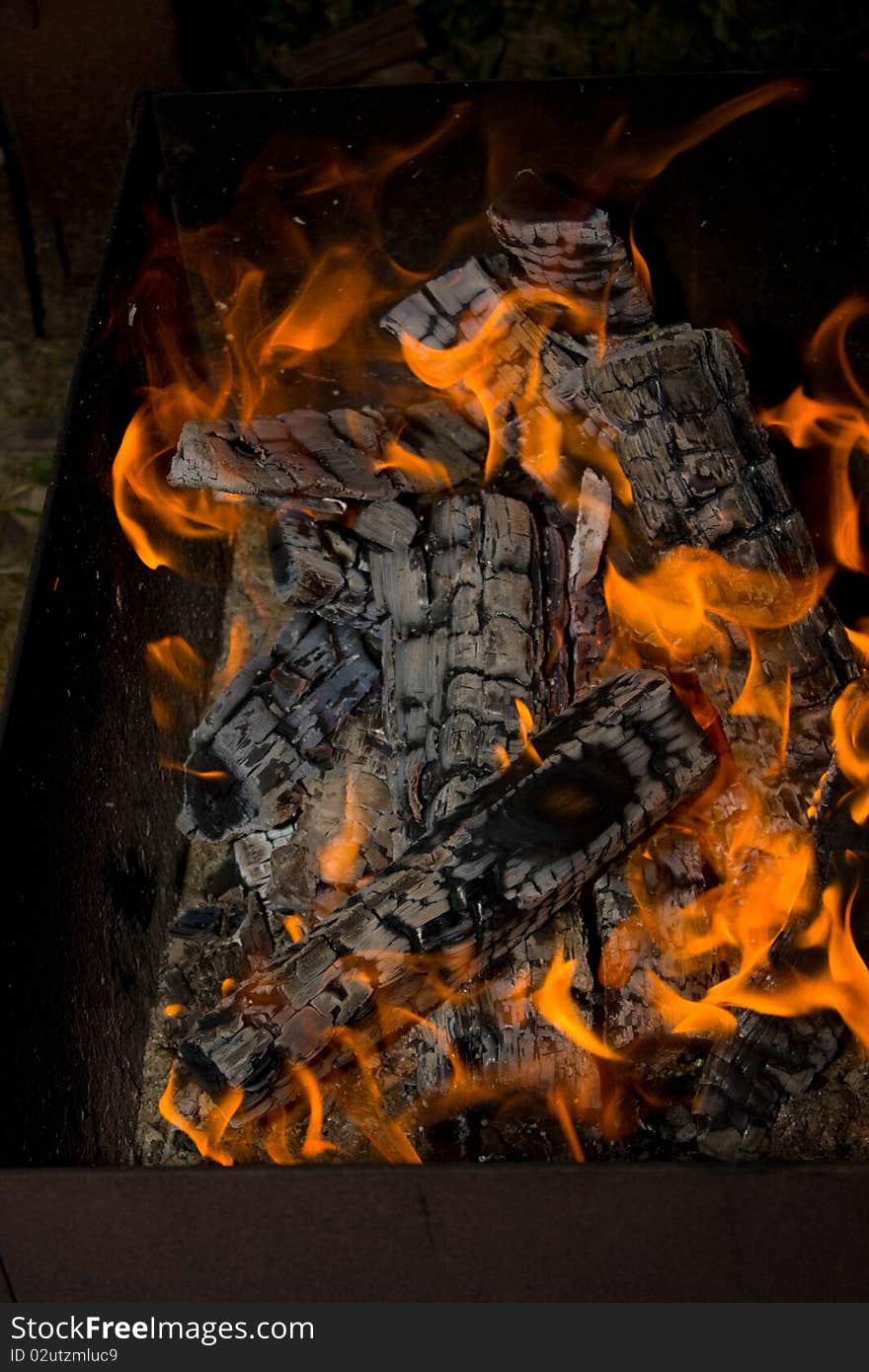 Burning wood in a fire close to making kebab. Burning wood in a fire close to making kebab