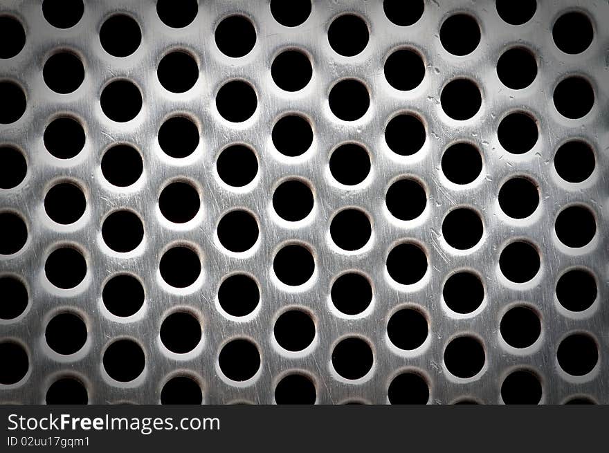 Lattice of white metal with a black background. Lattice of white metal with a black background.