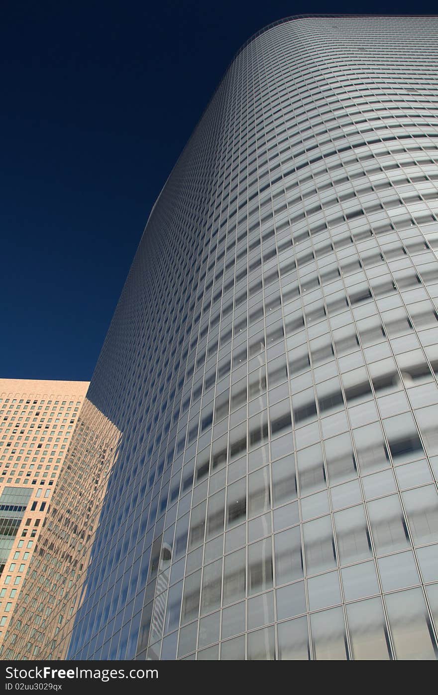 Reflection on a glass tower in Shiodome, Tokyo, Japan