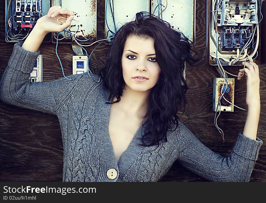 Beautiful young woman holding old wiring board. Beautiful young woman holding old wiring board