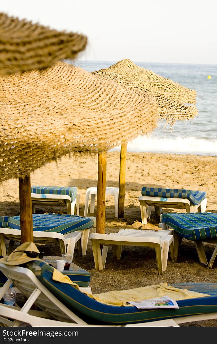 Straw Umbrella And Chairs