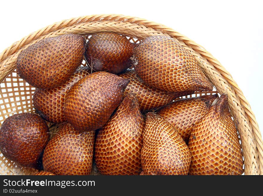 Red Zalacca fruit or snakefruit, Traditional seasonal Sweet fruit flavors of Thailand, in wooden basket