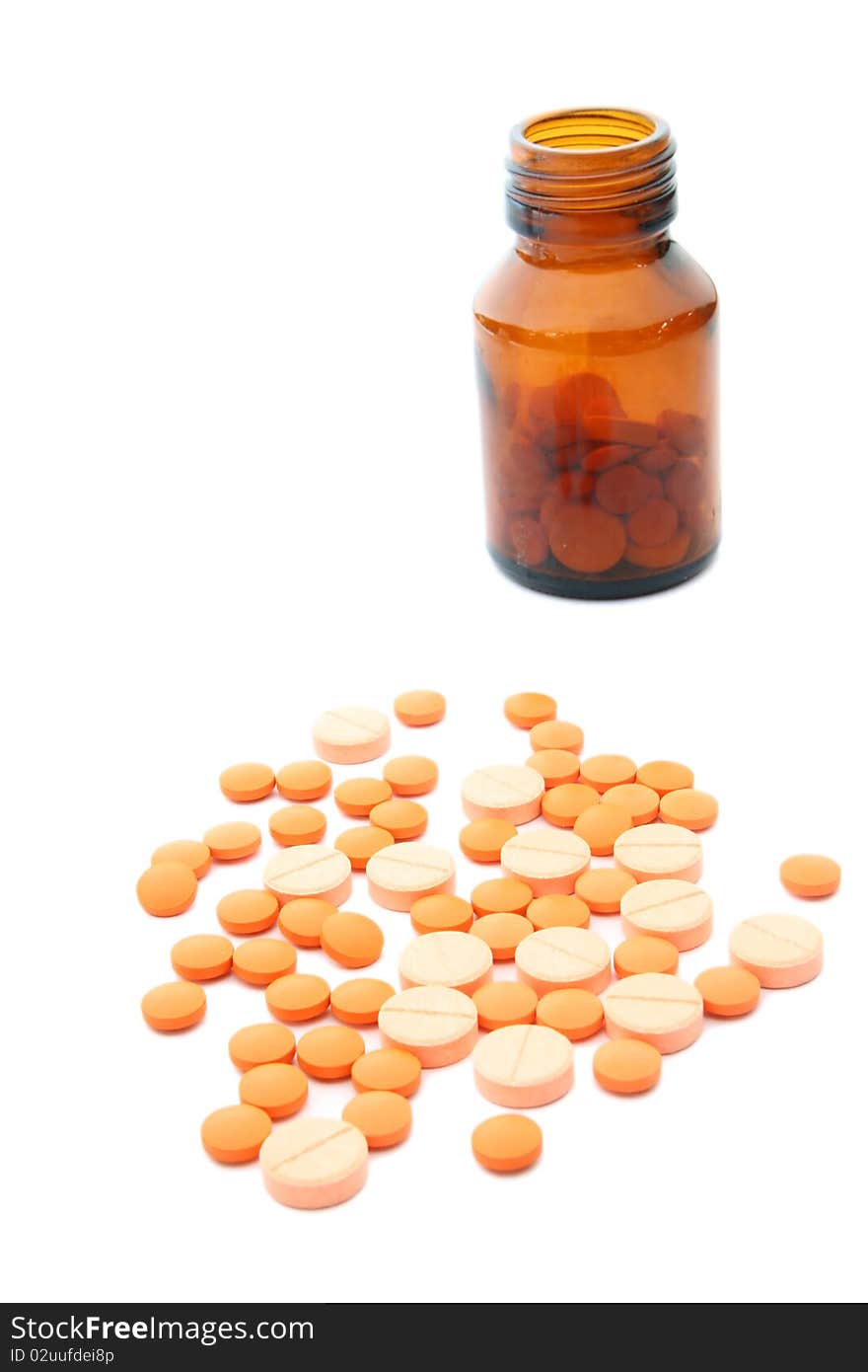 Heap of pills with bottle