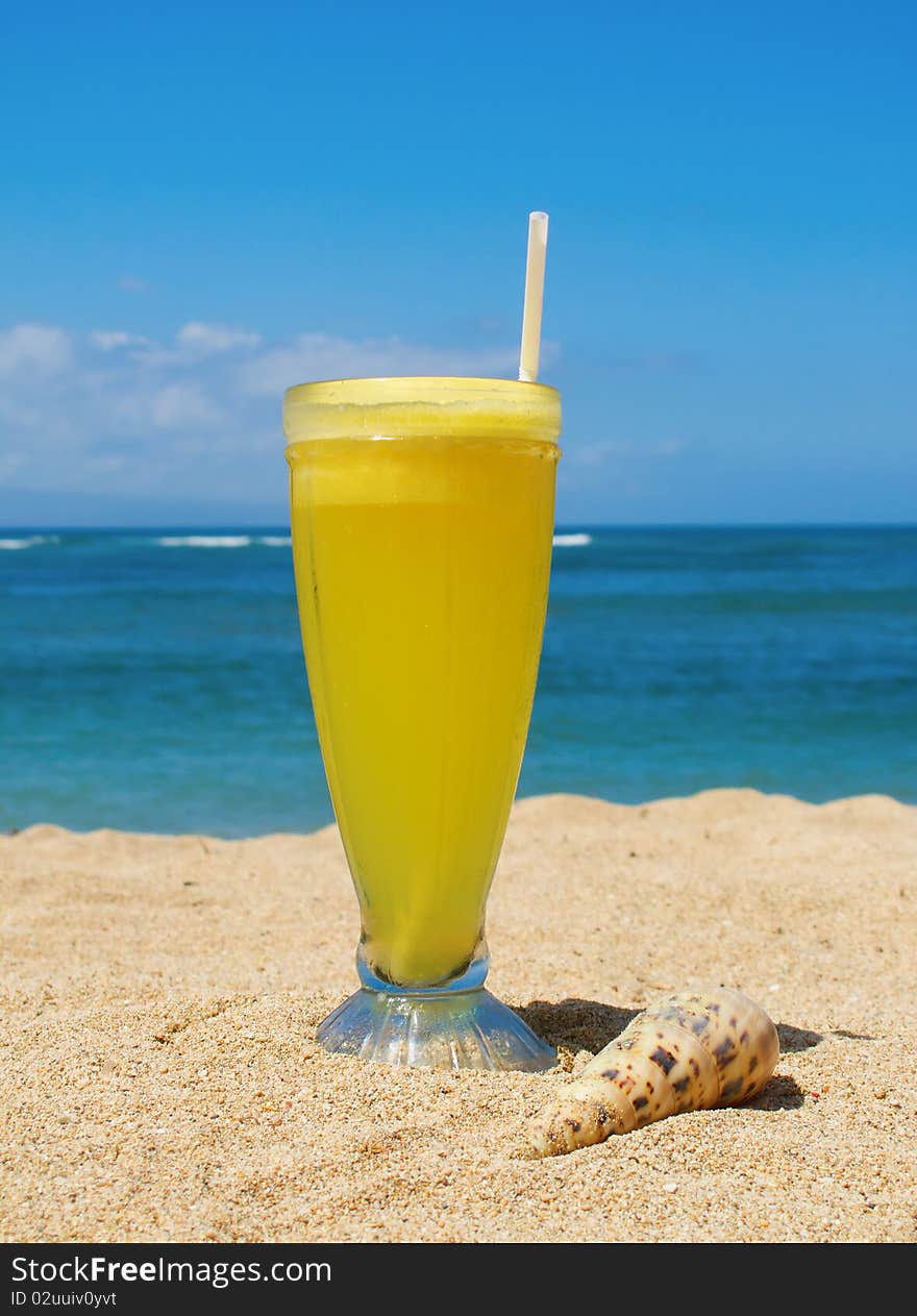 Fresh fruit cocktail on a tropical island beach