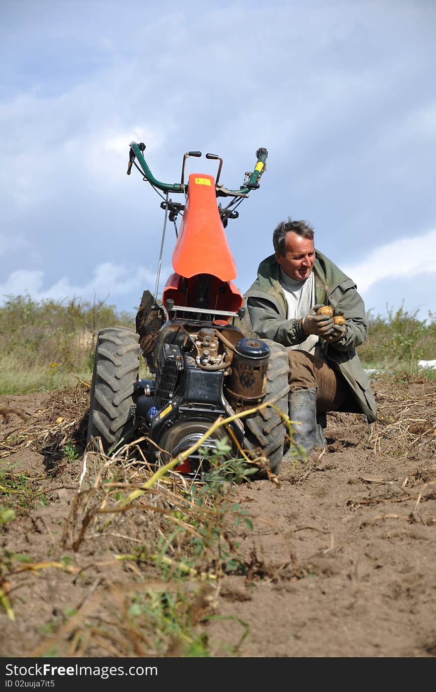 Farmer plowing the ground