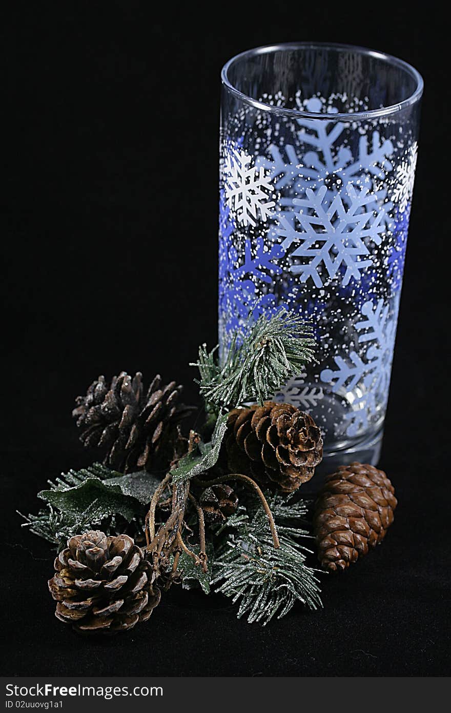 A glass with a branch of pine needles. A glass with a branch of pine needles