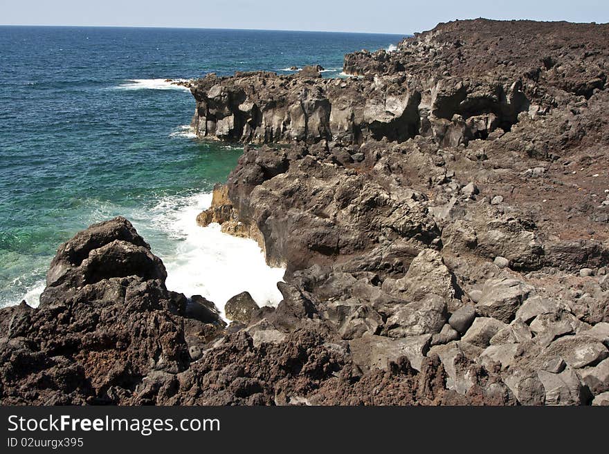 Vulcanic coastline with waves in Lanzarote, Spain. Vulcanic coastline with waves in Lanzarote, Spain