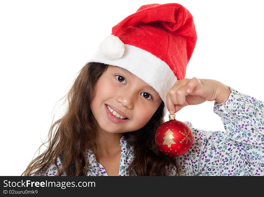 Christmas, charming child with Christmas bonnet and Christmas tree ball before white background