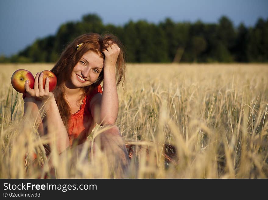 Redhead with apples