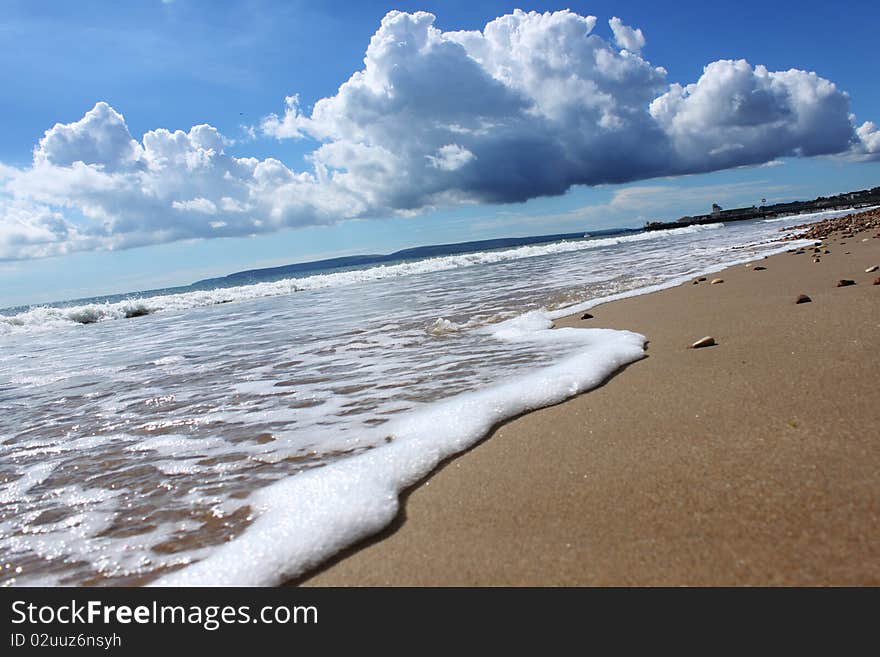 Blue sky, beautiful clouds, golden sand,waves. Blue sky, beautiful clouds, golden sand,waves