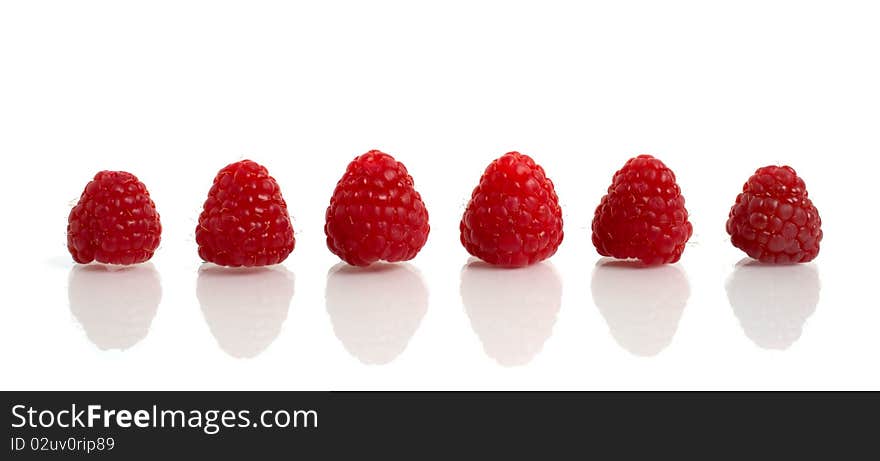 Red raspberry with reflection isolated on white