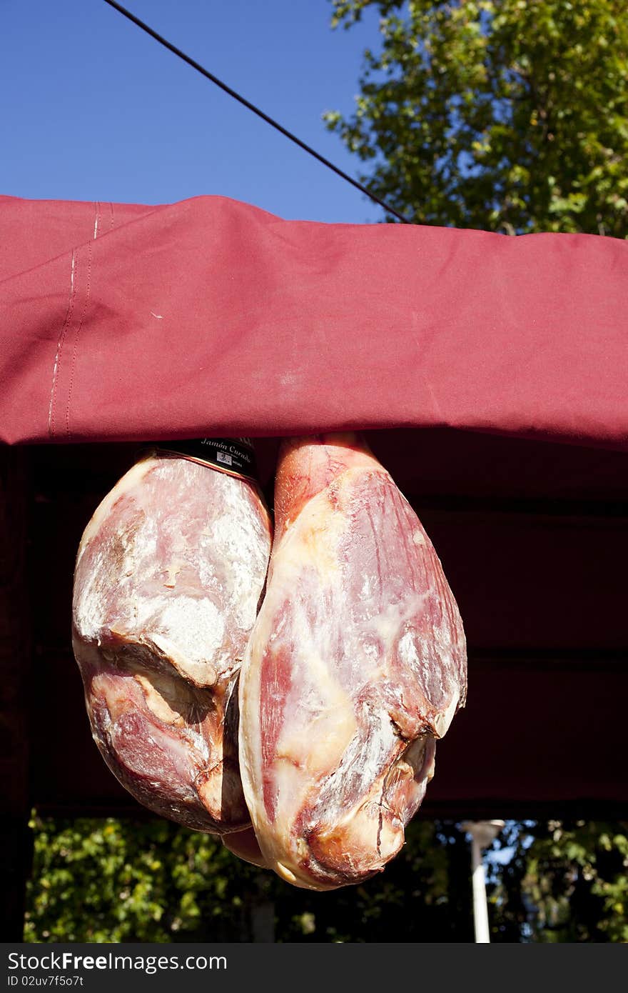 Exposed ham hanging in a stall