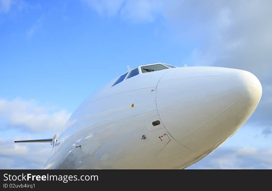 White passenger airplane, cockpit, view with a side. White passenger airplane, cockpit, view with a side