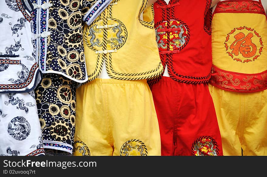 Lovey and colorful clothing for children in Chinese traditional style, shown as happy and lucky meaning. Lovey and colorful clothing for children in Chinese traditional style, shown as happy and lucky meaning.