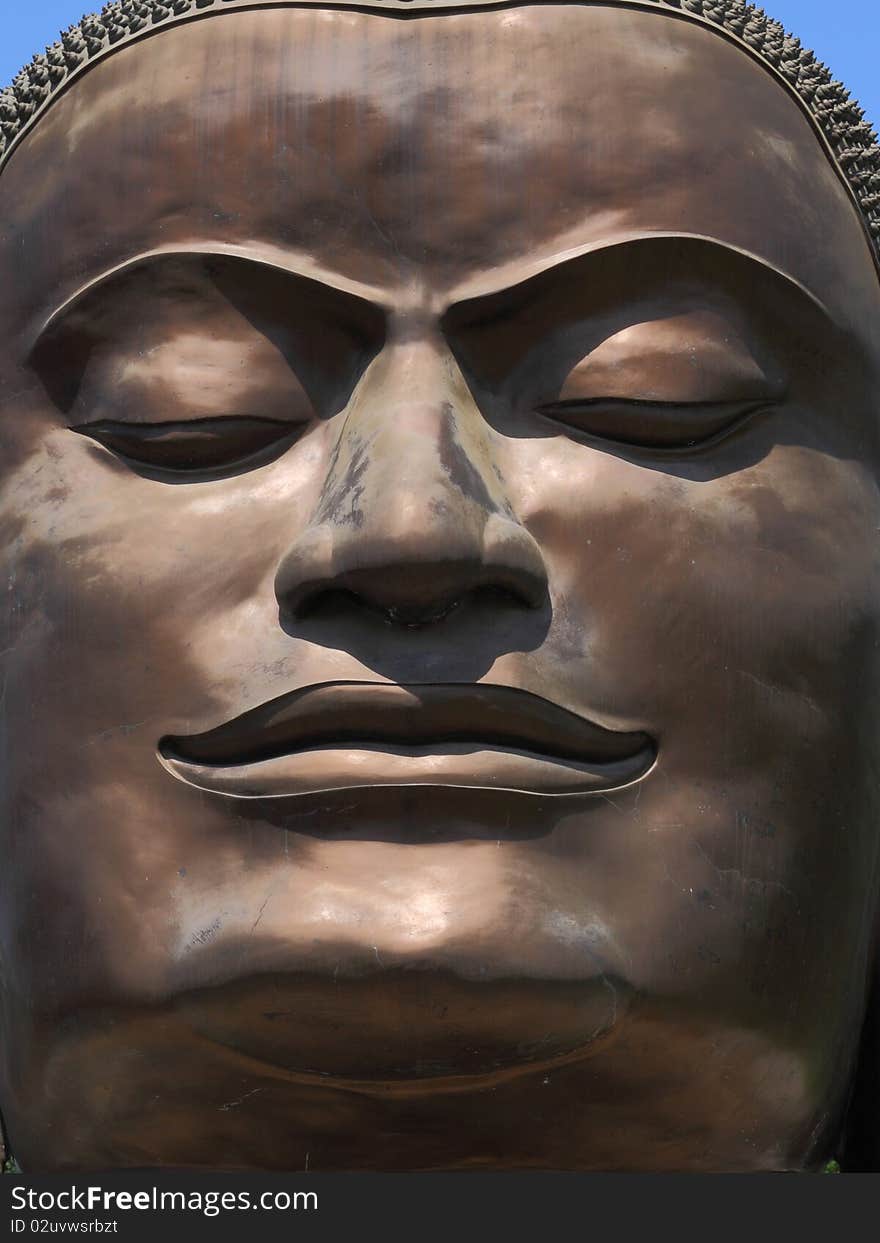 Face of Buddha from the temple of Wat Tummickarat in Ayutthaya Historic Park, Thailand. Ayutthaya is one of world heritage park. Face of Buddha from the temple of Wat Tummickarat in Ayutthaya Historic Park, Thailand. Ayutthaya is one of world heritage park.