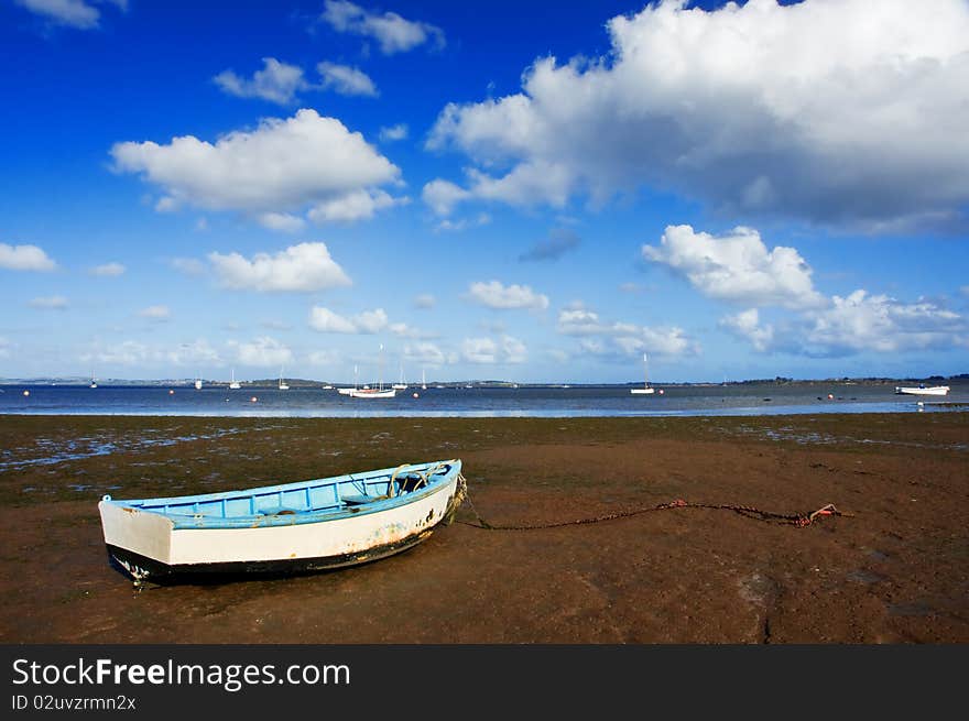 Row boat on mud flat. Row boat on mud flat