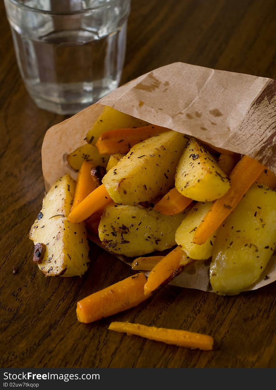 Roasted garlic potatoes and carrots with seasalt and rosemary. Roasted garlic potatoes and carrots with seasalt and rosemary.