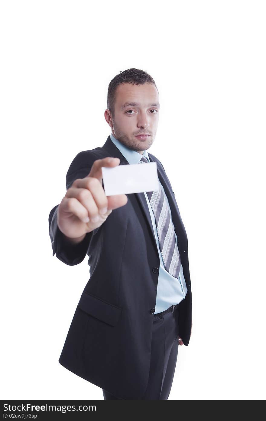 Young businessman is holding blank business card between two fingers. Young businessman is holding blank business card between two fingers