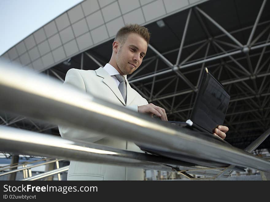 Businessman portrait with laptop