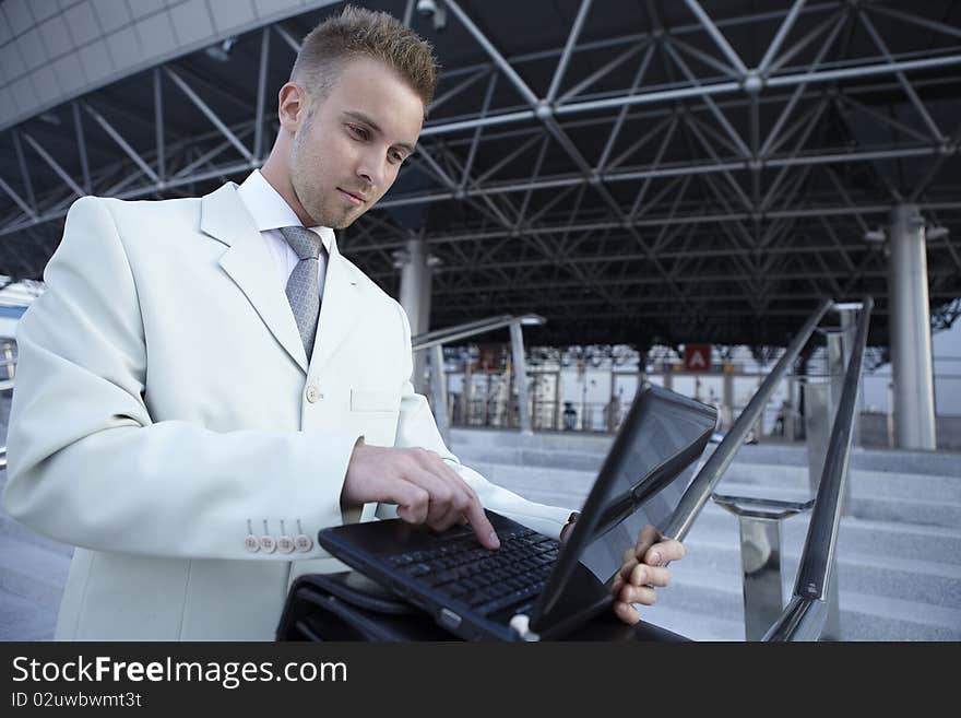 Businessman portrait with laptop