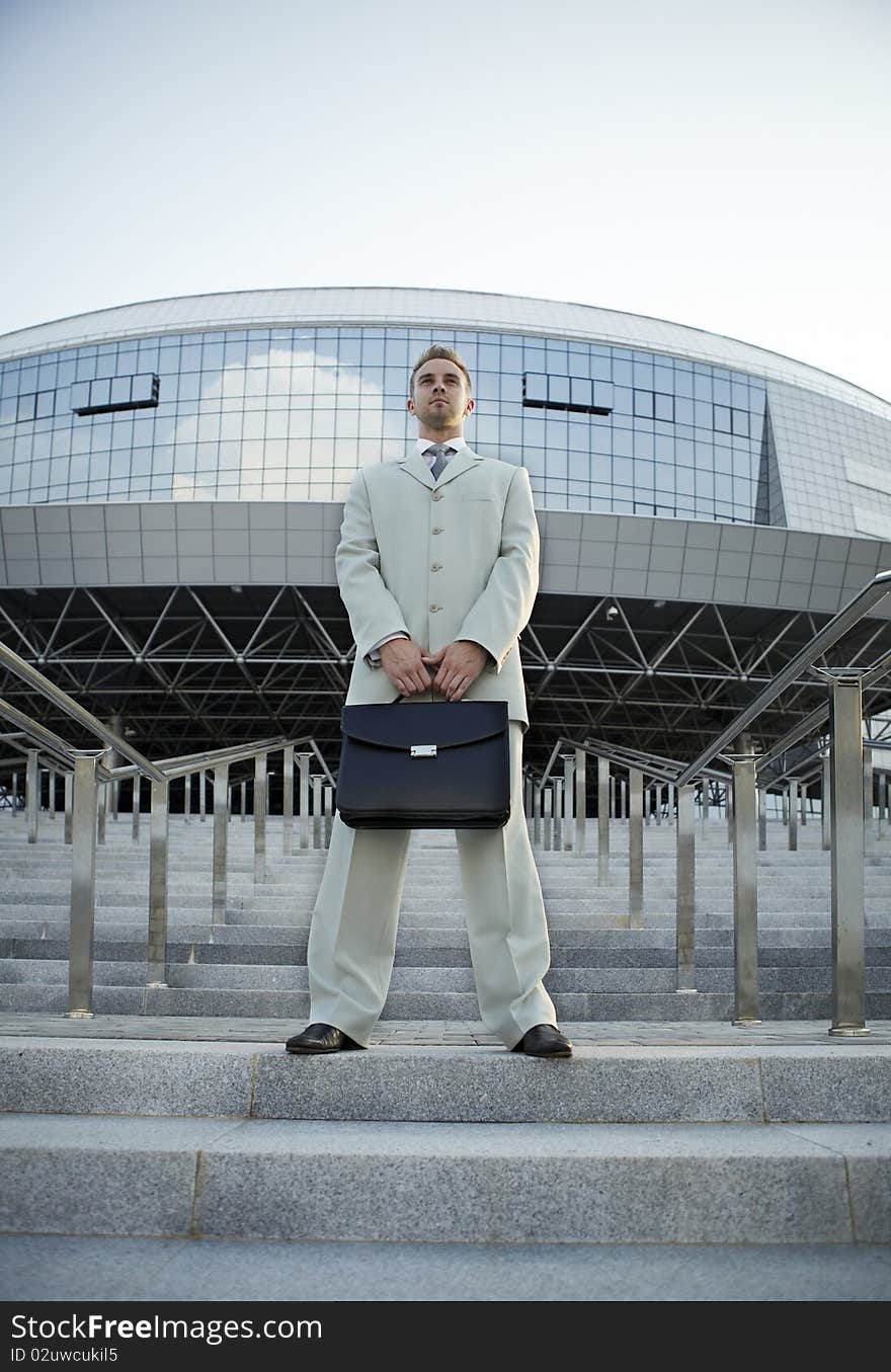 Businessman posing on stairs. photo