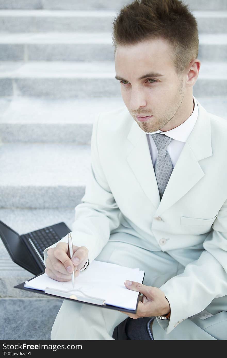 Businessman portrait with laptop