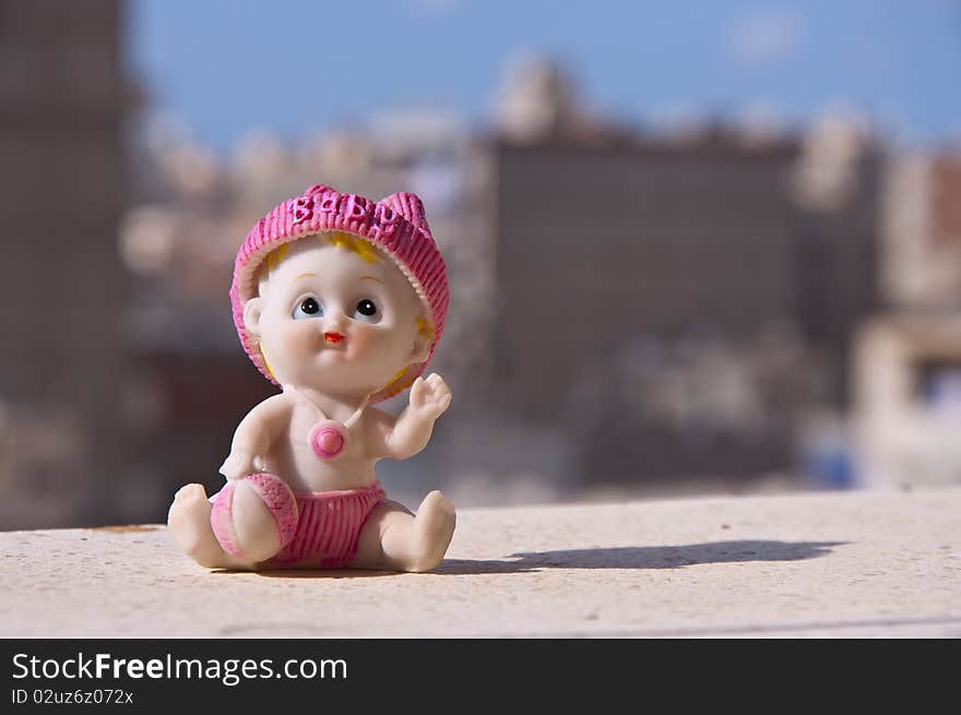 A Baby Ceramic Toy Statue