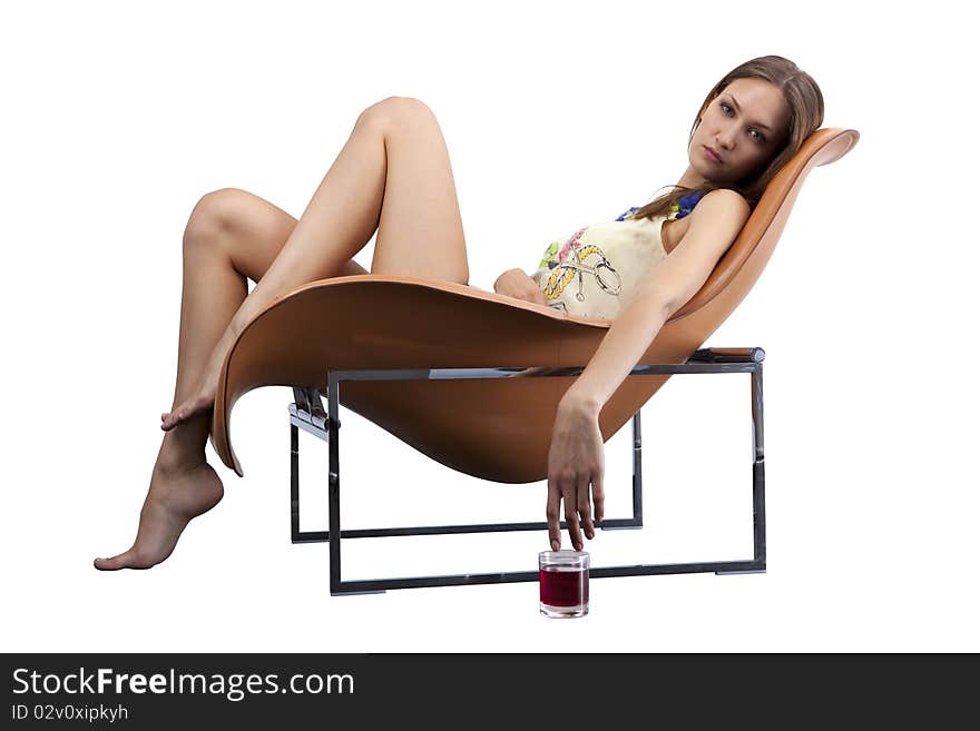 Young Female Relaxing In The Fashionable Chair Wit