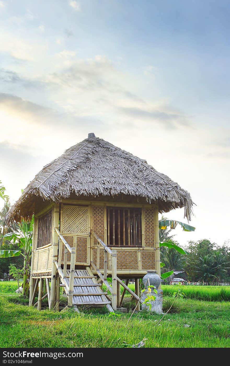 Beautiful classic wooden house in the middle of the rice field