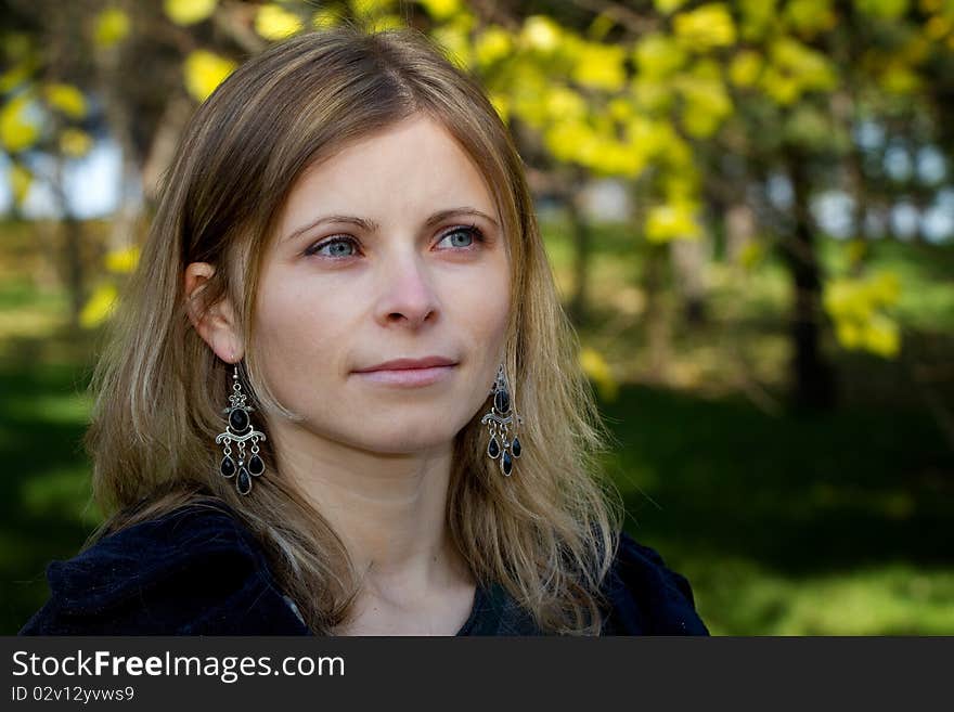 Woman portrait outdoor in autumn light. Woman portrait outdoor in autumn light