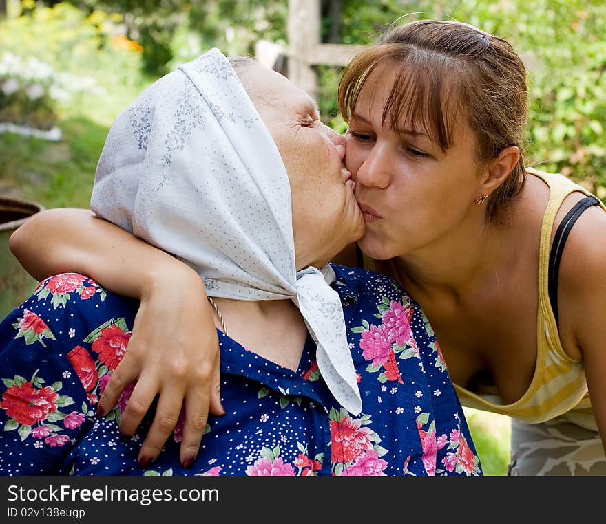 Grandmother and granddaughter embraced and happy outdoor