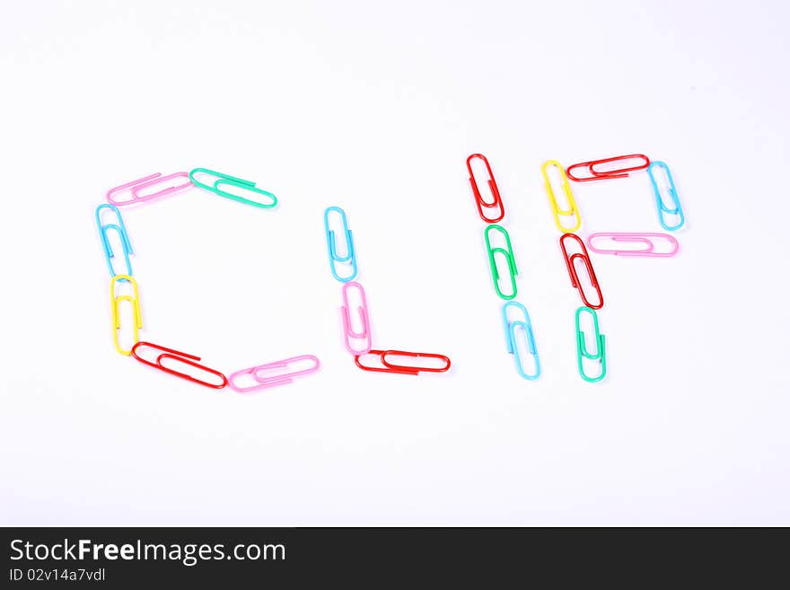 Paper clip with colorful and white background. Paper clip with colorful and white background