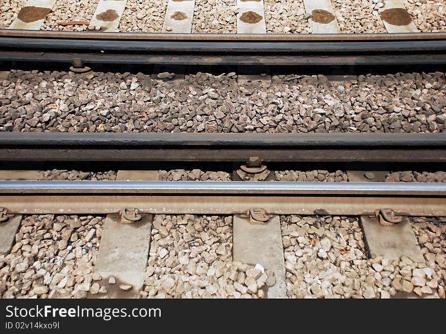 Empty rails covered by pebbles