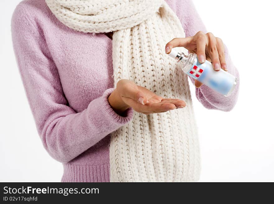 Woman squirts a squirt of antibacterial liquid soap into her palm. Woman squirts a squirt of antibacterial liquid soap into her palm.