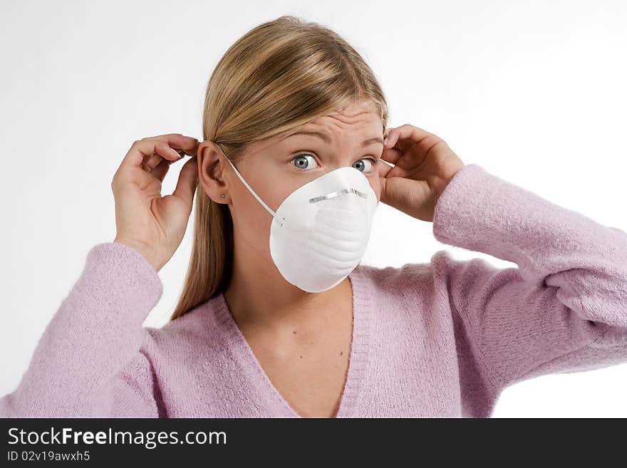 Young woman with protecting mask, white background