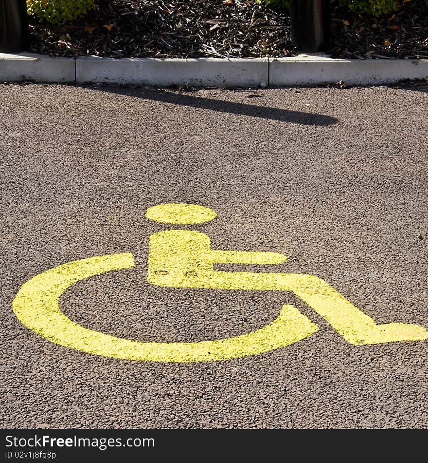 Yellow painted disabled parking bay