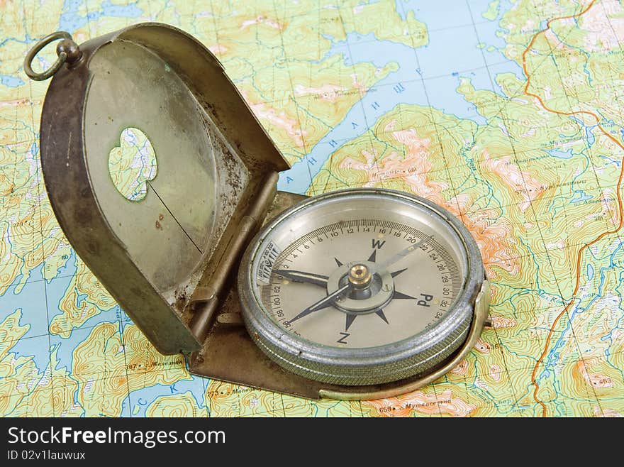 Close up of compass on topographical map