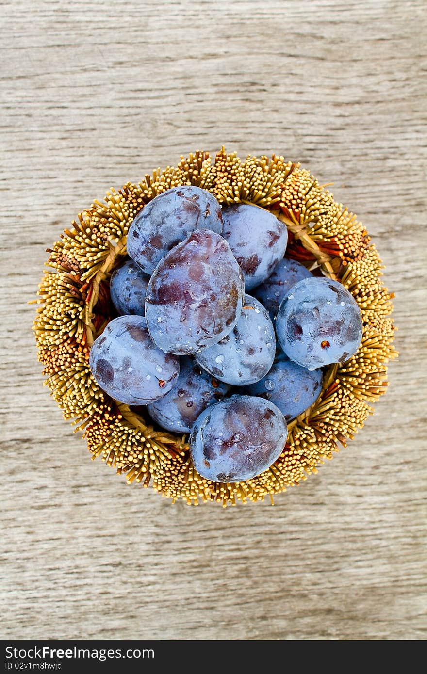 Plums in a wicker basket