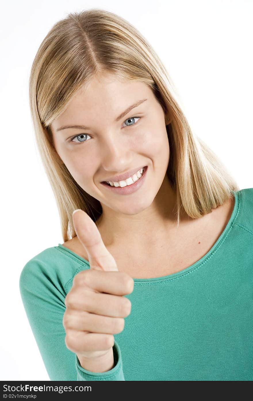 Beautiful teenage girl with thumbs-up, isolated on white