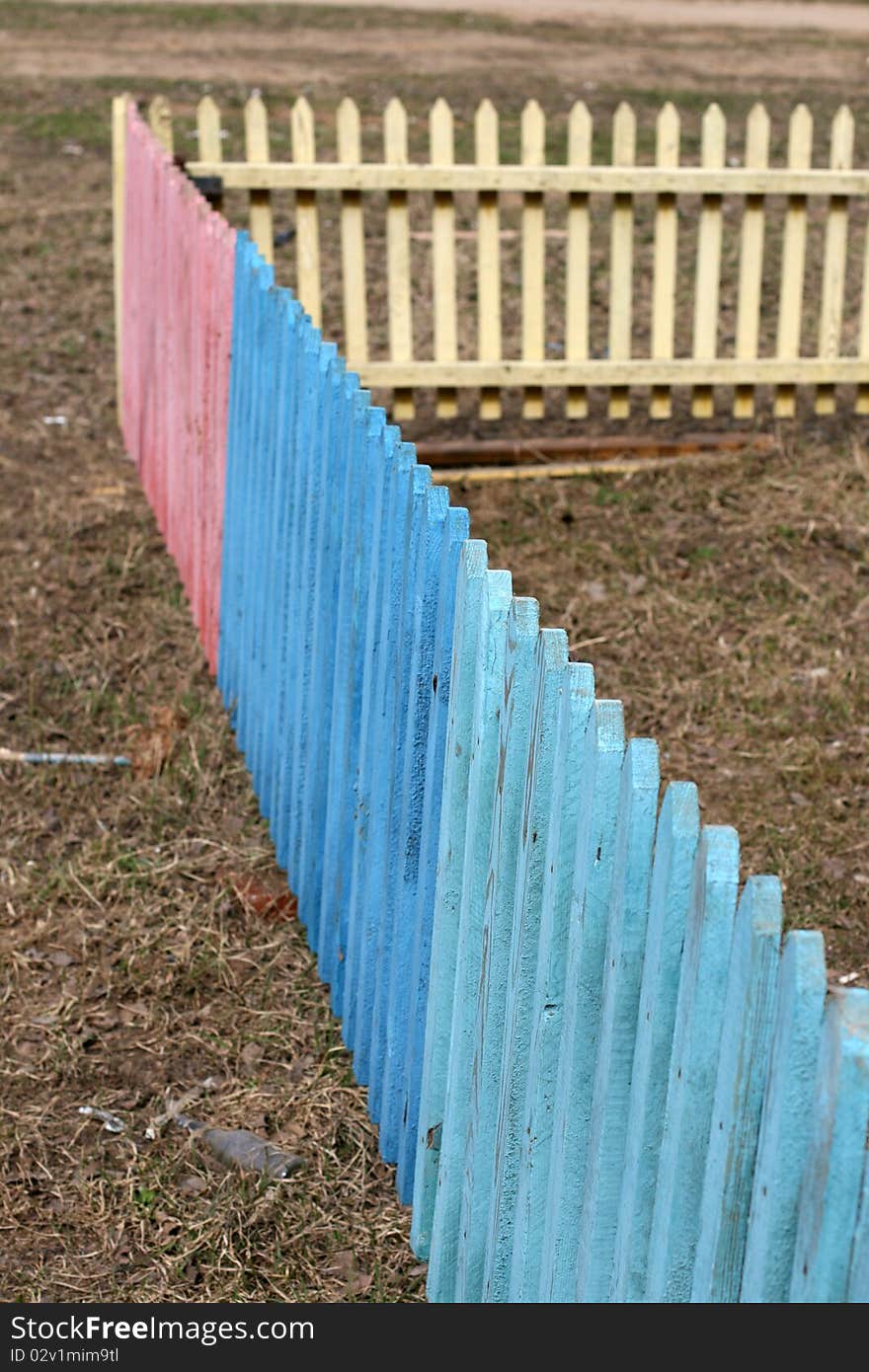 Wooden fence of different colors