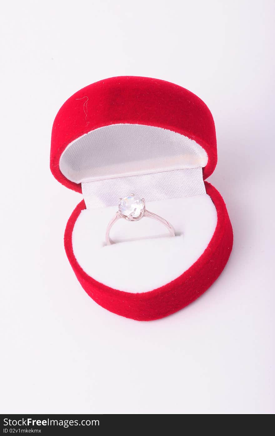 Diamond engagement ring in a red box. Diamond engagement ring in a red box