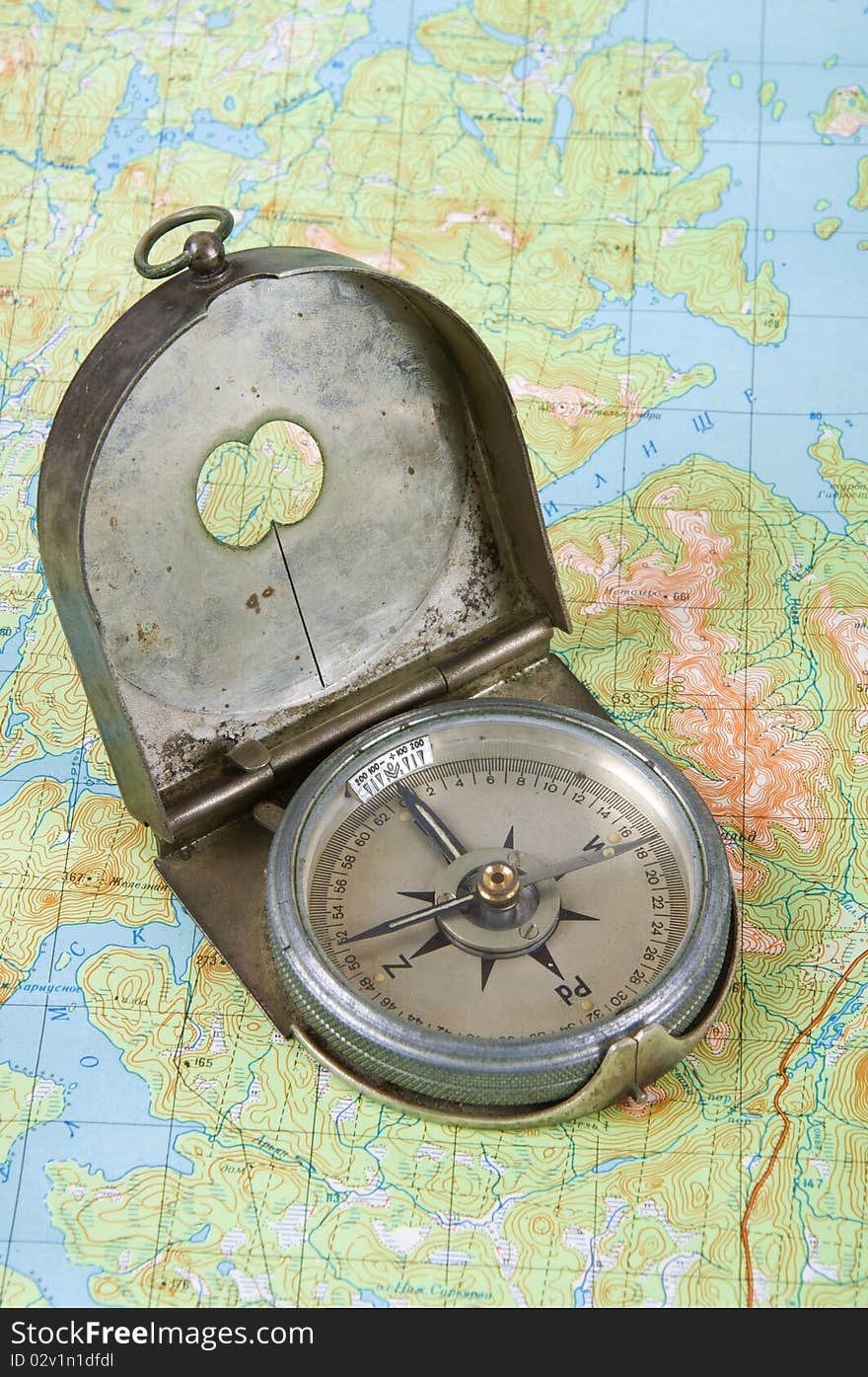 Close up of compass on topographical map